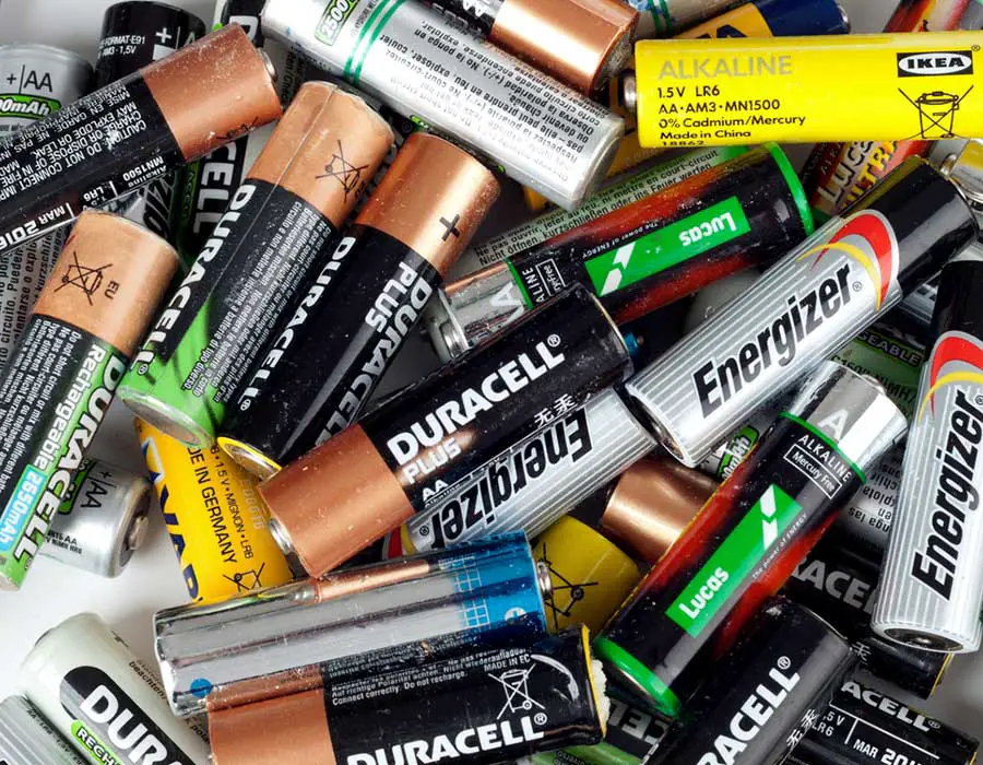 pile of duracell and energizer batteries
